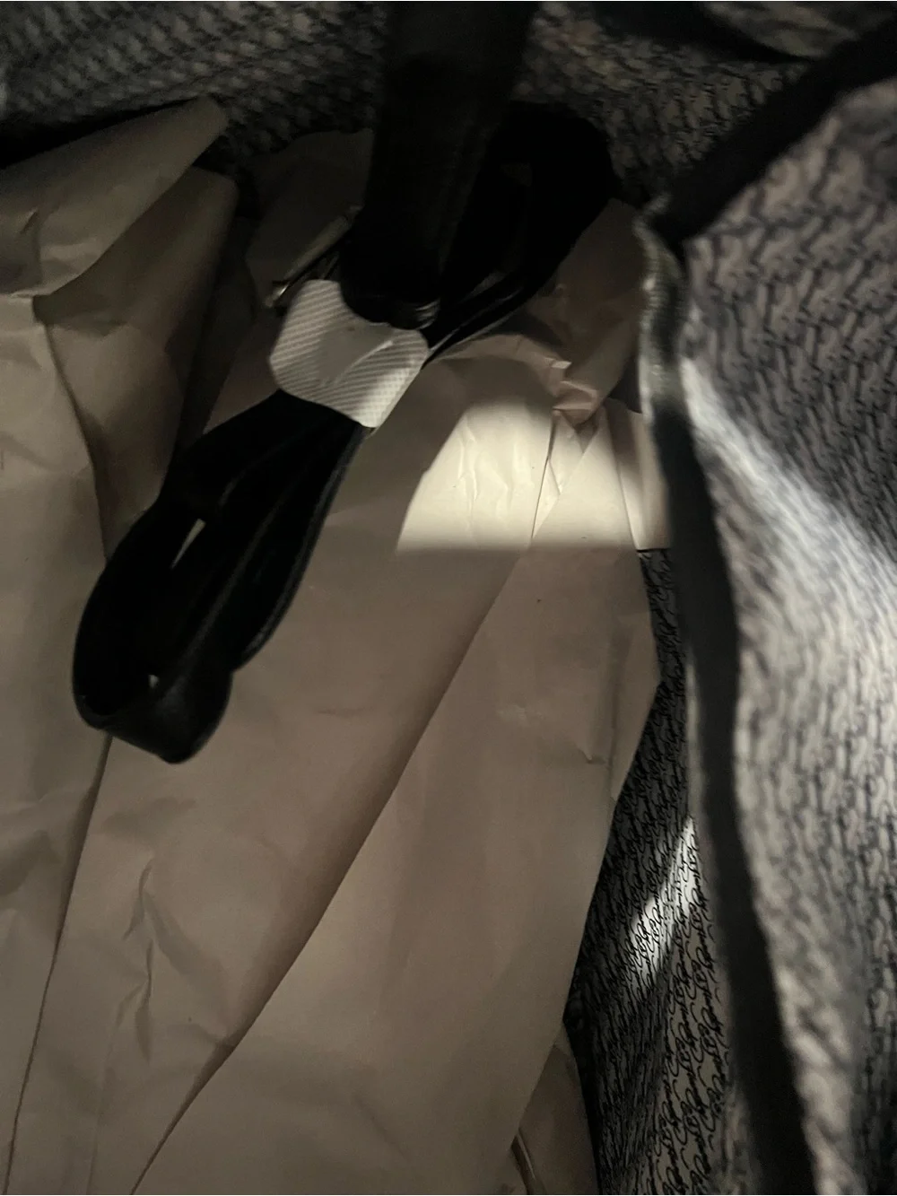 Ed Hardy duffel bag features a black and grey checkered pattern